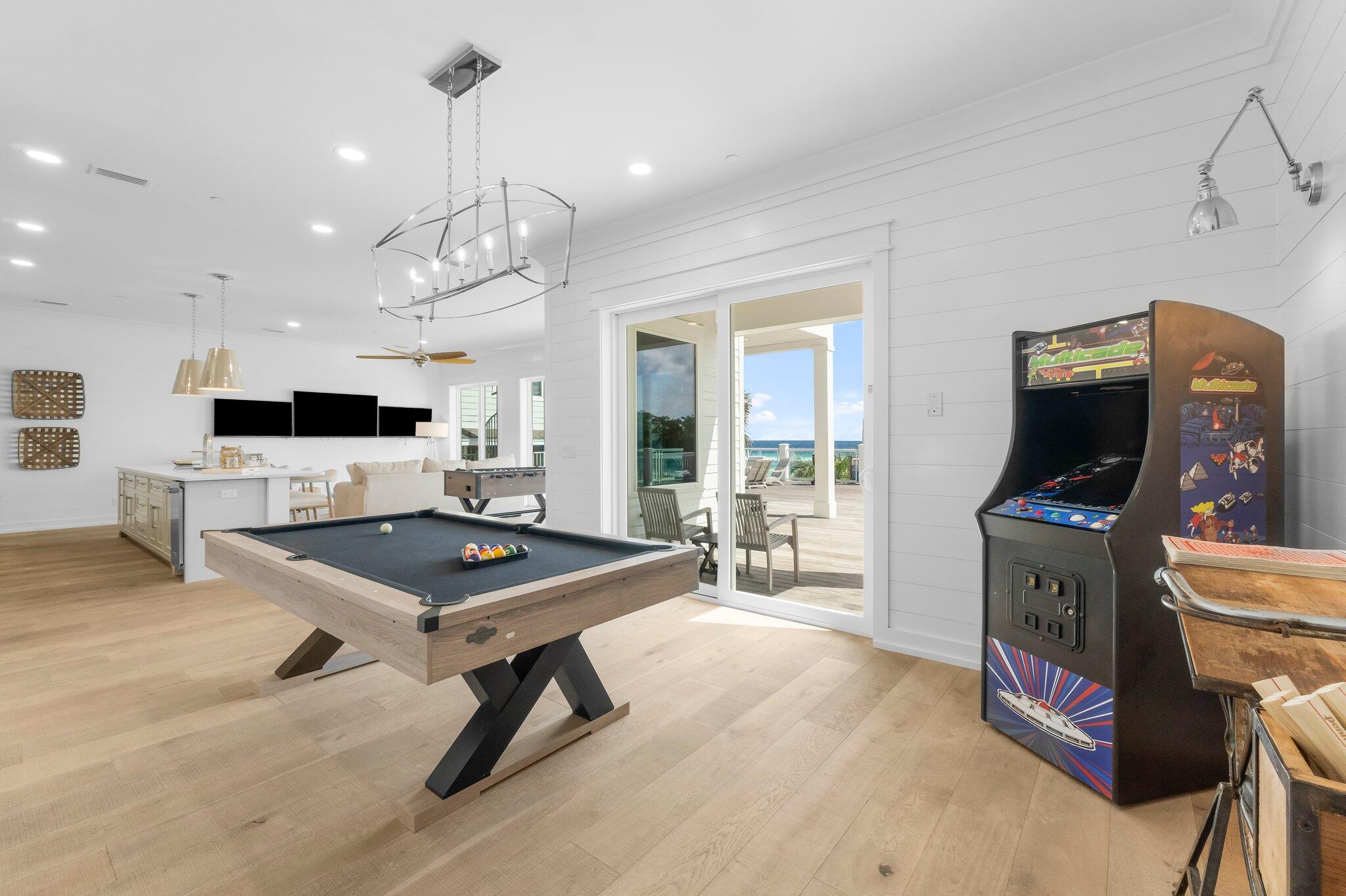 22015 Front Beach Road Panama City Beach, FL 32413 - Photo 35 of 104 a room with furniture a flat screen tv and kitchen view