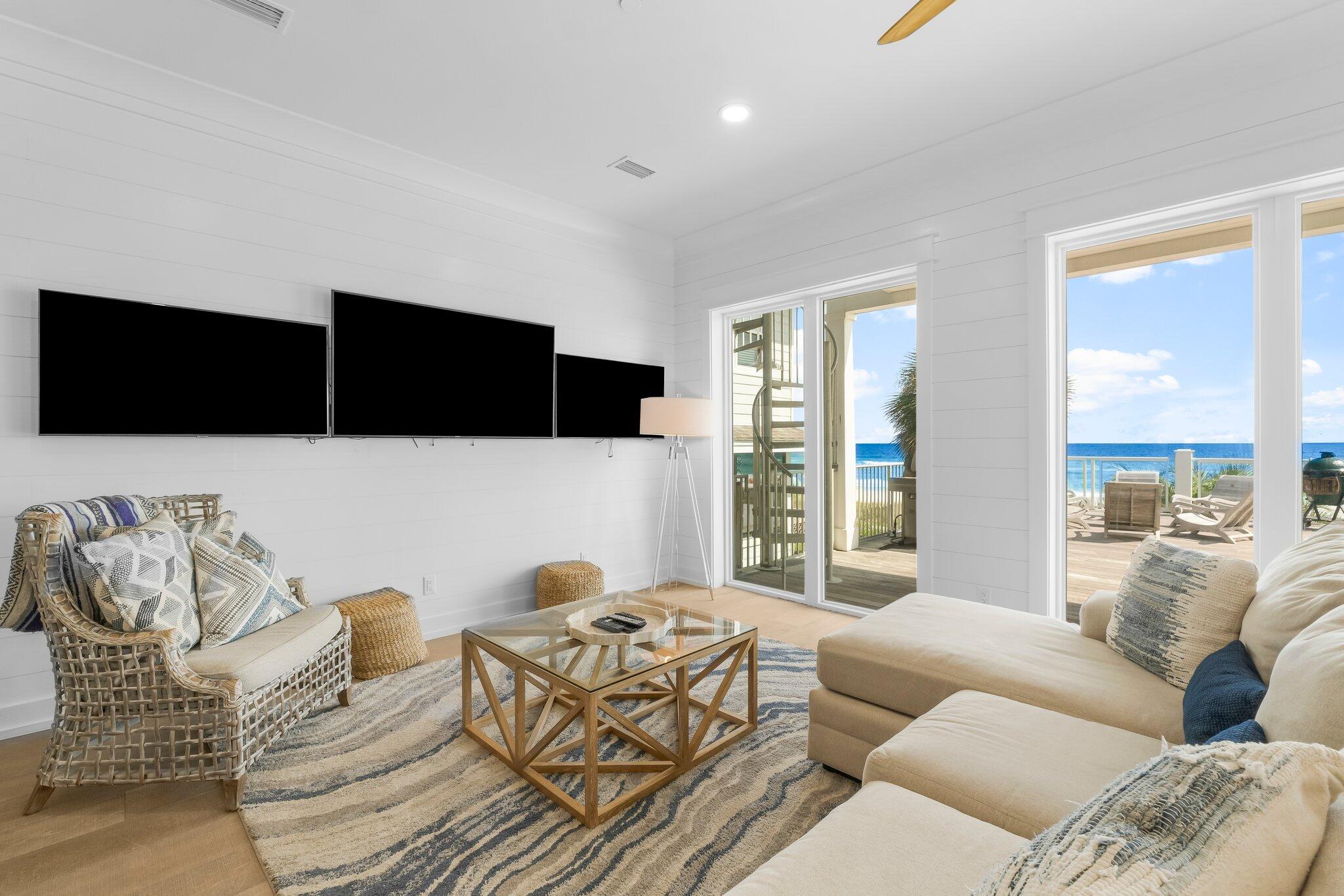 22015 Front Beach Road Panama City Beach, FL 32413 - Photo 42 of 104 a living room with furniture and a flat screen tv