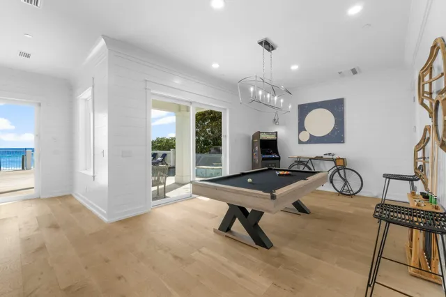a hotel room with a bed and a flat tv screen on wall