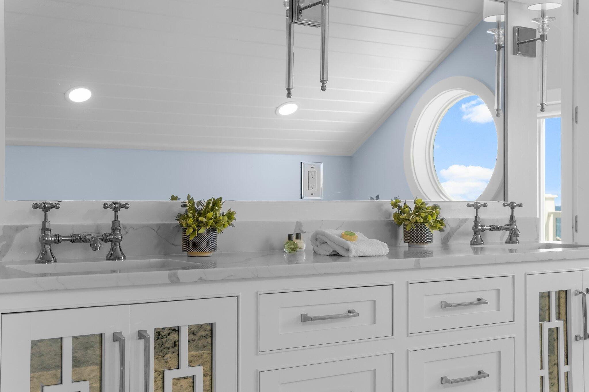 22015 Front Beach Road Panama City Beach, FL 32413 - Photo 50 of 104 a bathroom with a double vanity sink and a mirror