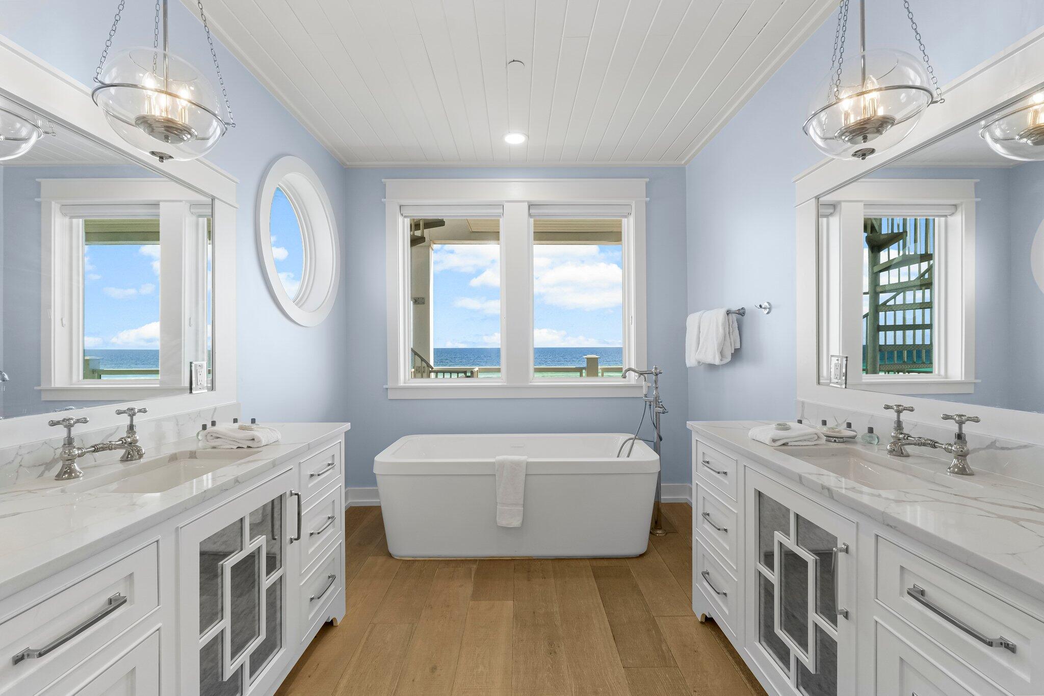 22015 Front Beach Road Panama City Beach, FL 32413 - Photo 53 of 104 a spacious bathroom with a double vanity sink and a mirror