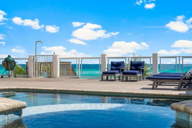 a large living room with stainless steel appliances granite countertop a couch and a view of living room