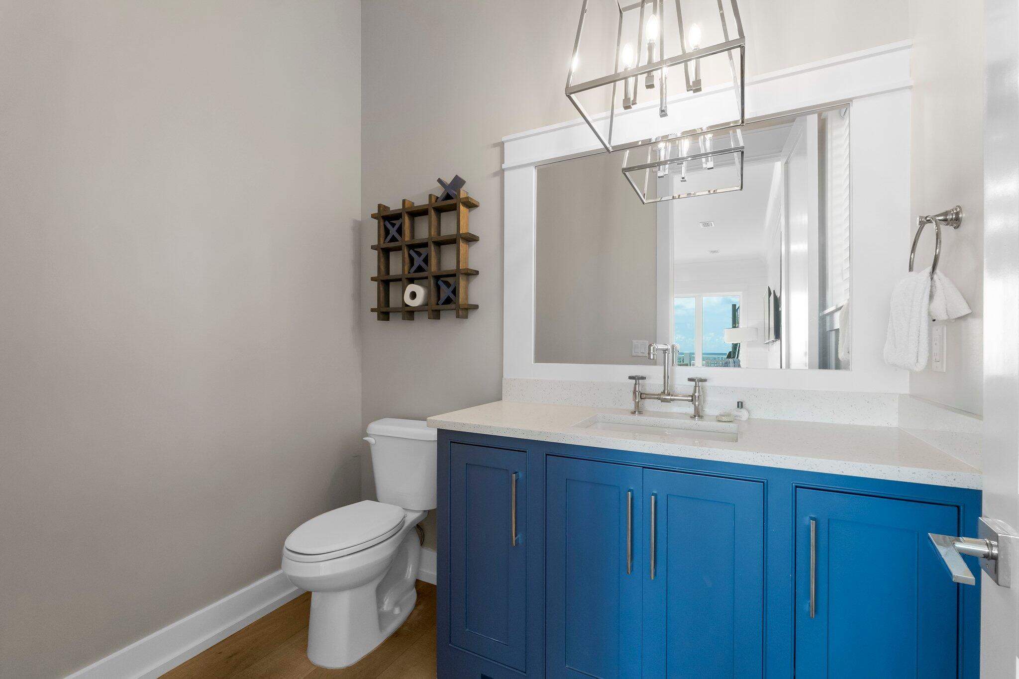 22015 Front Beach Road Panama City Beach, FL 32413 - Photo 93 of 104 a bathroom with a toilet a sink and mirror