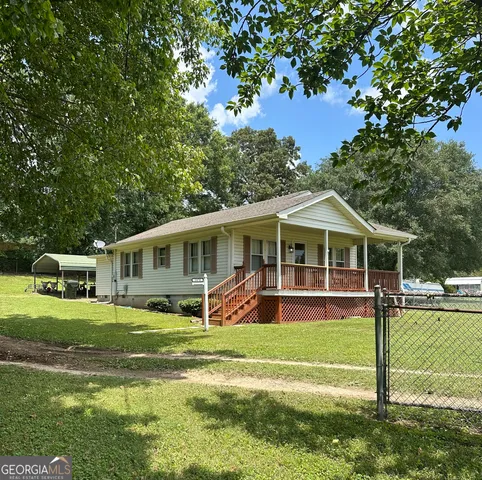 a view of a house with a big yard