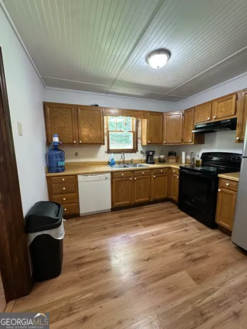 a bedroom with a bed and a television