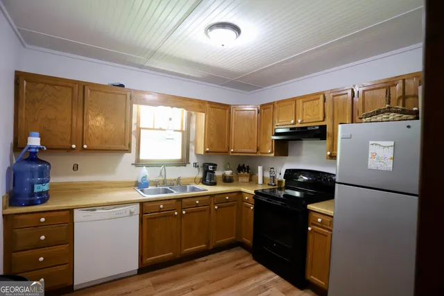 a bedroom with double bed and a chandelier