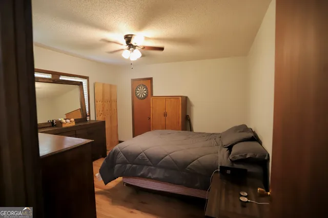 a room with wooden floor and furniture