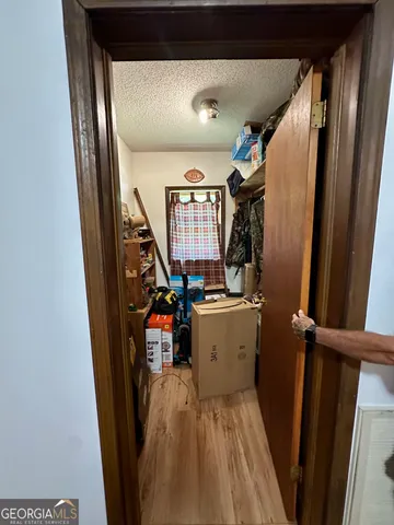 a view of a workspace with furniture and storage