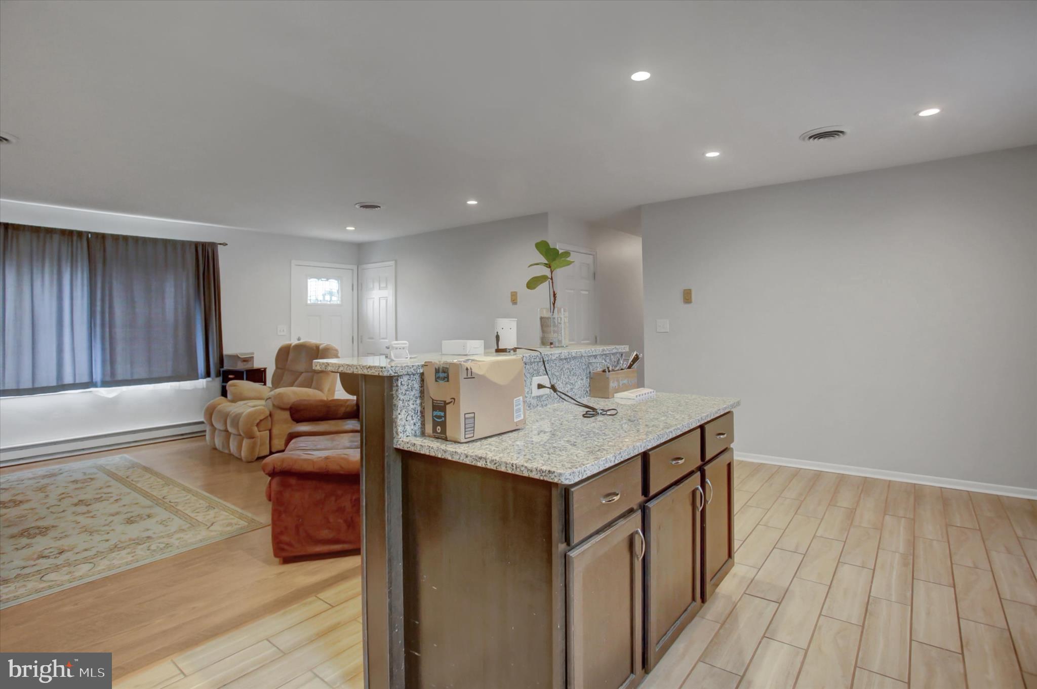 501 Cornell Avenue Hagerstown, MD 21742 - Photo 12 of 28 a kitchen with stainless steel appliances granite countertop a sink and a stove with wooden floor