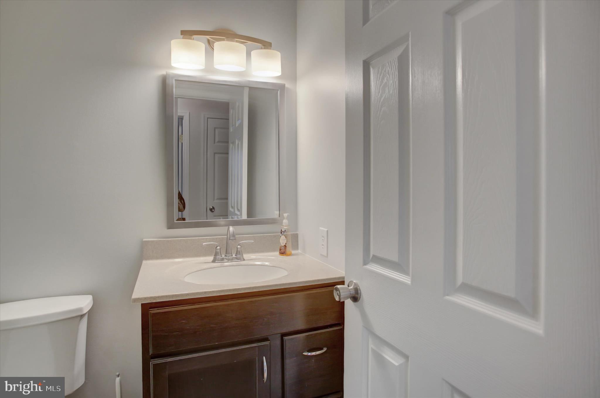 501 Cornell Avenue Hagerstown, MD 21742 - Photo 15 of 28 a bathroom with a sink and a mirror