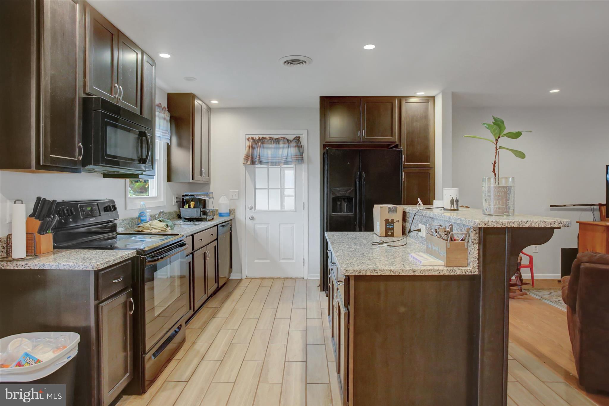501 Cornell Avenue Hagerstown, MD 21742 - Photo 10 of 28 a kitchen with stainless steel appliances granite countertop a sink stove and refrigerator