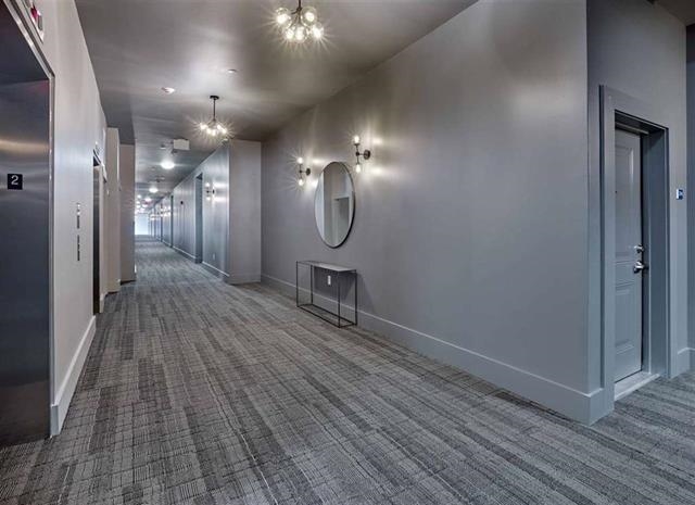 250 Ave East, Unit 611 Bayonne, NJ 07002 - Photo 9 of 17 wooden floor in an empty room with a mirror