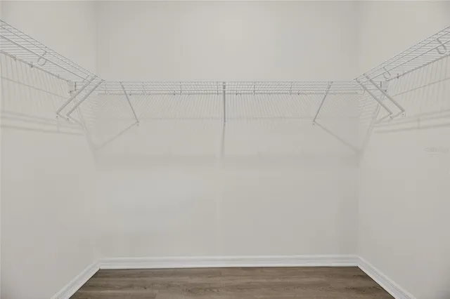 an aerial view of residential houses with outdoor space and street view