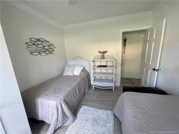 a bedroom with a bed and a walk in closet