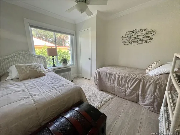 a bedroom with a bed and window