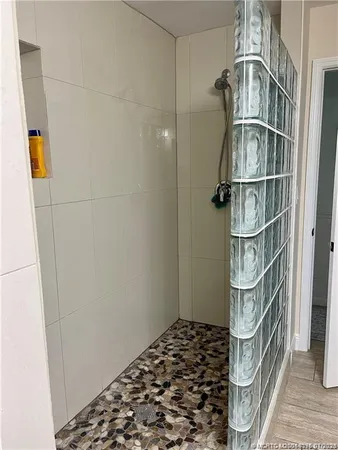 a view of a house with backyard sitting area and garden