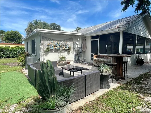 a living room with furniture a table and chairs