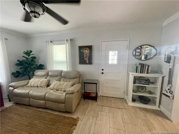 a living room with furniture and a large window