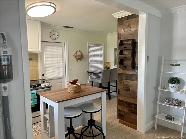 a kitchen with a table and chairs in it