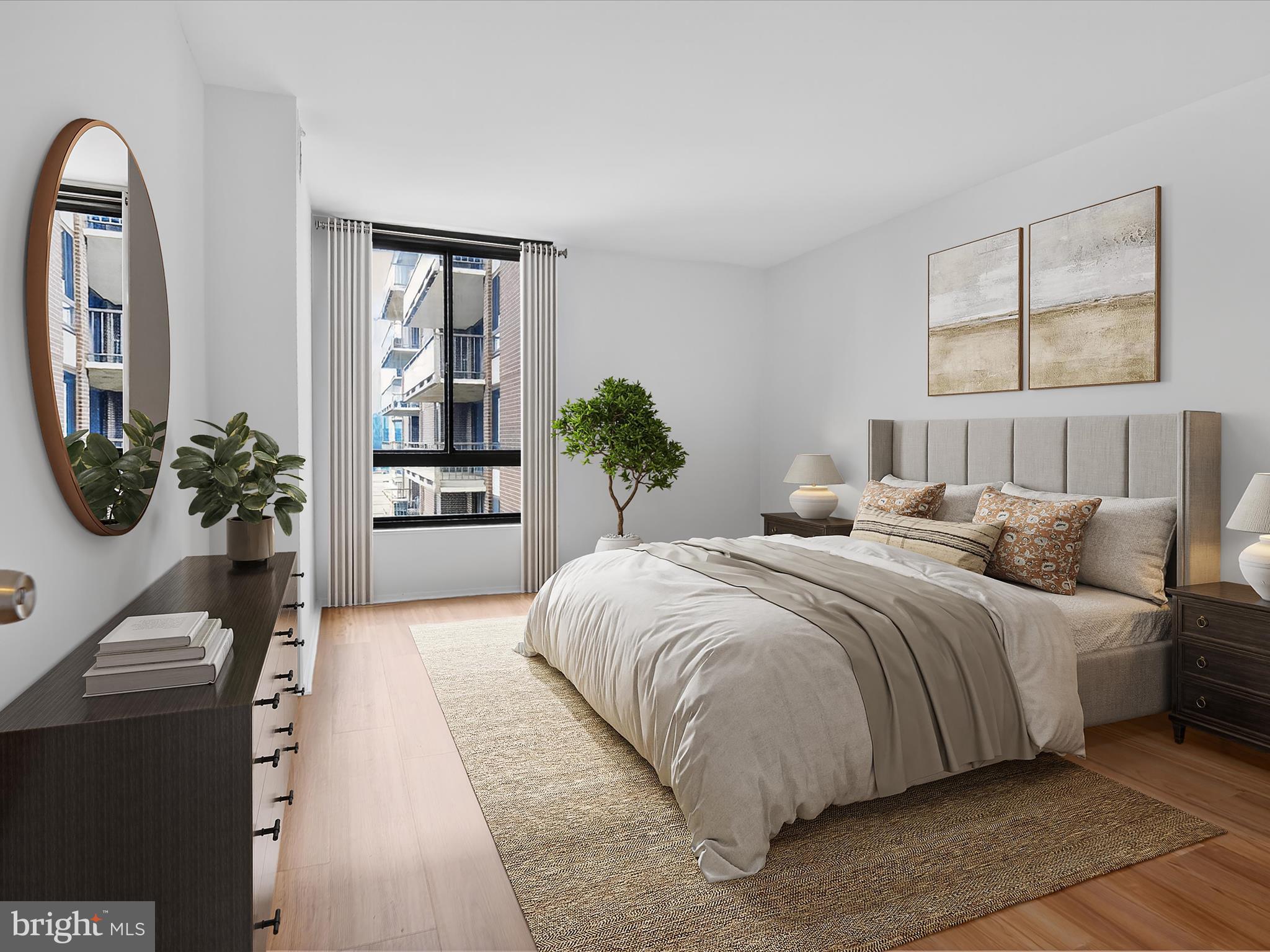 1800 Old Meadow Road, Unit 1415 McLean, VA 22102 - Photo 11 of 29 a bedroom with a large bed and a potted plant