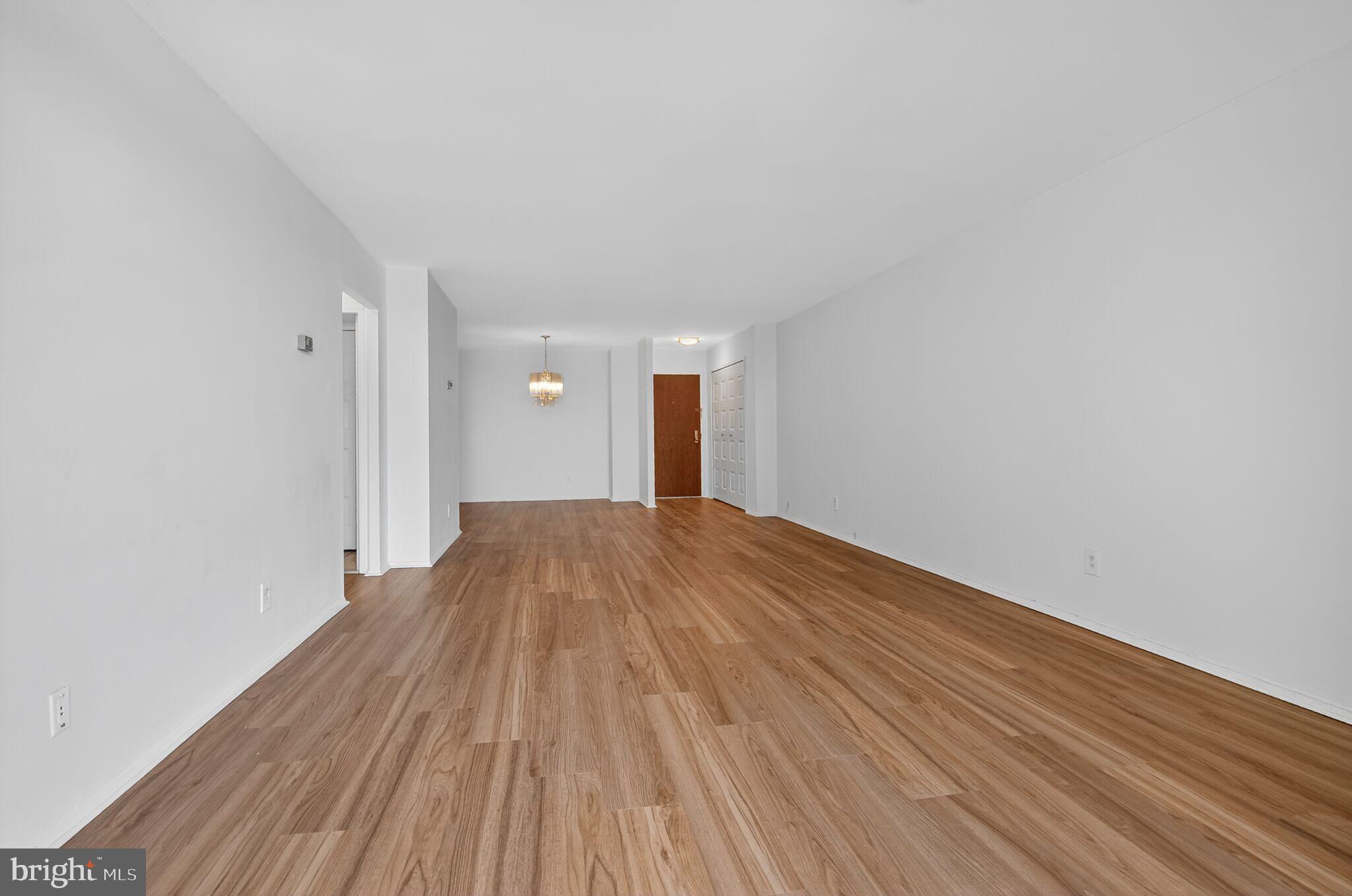 1800 Old Meadow Road, Unit 1415 McLean, VA 22102 - Photo 28 of 29 a view of a room with wooden floor
