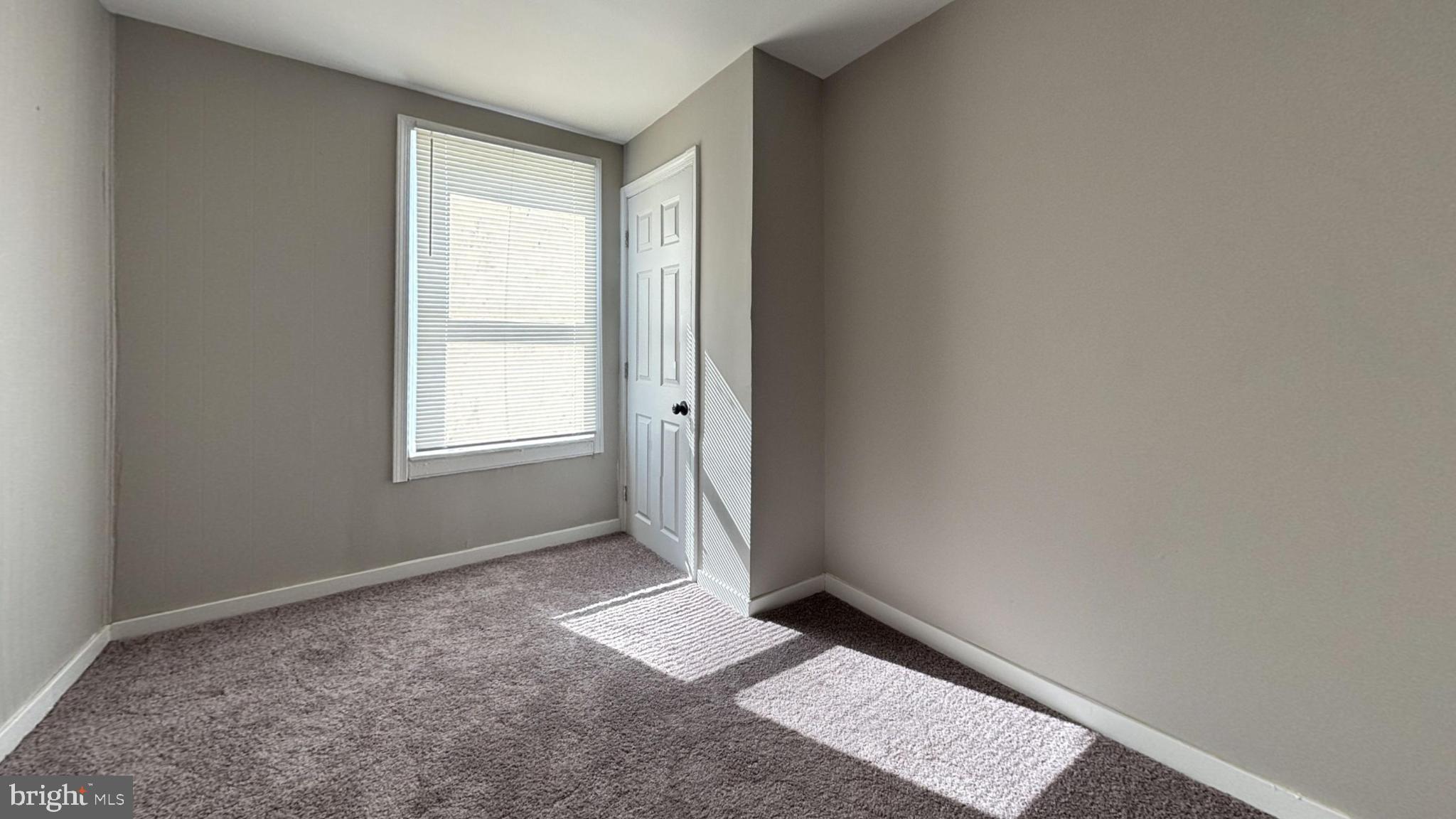 2644 South Felton Street Philadelphia, PA 19142 - Photo 7 of 9 a view of an empty room and window