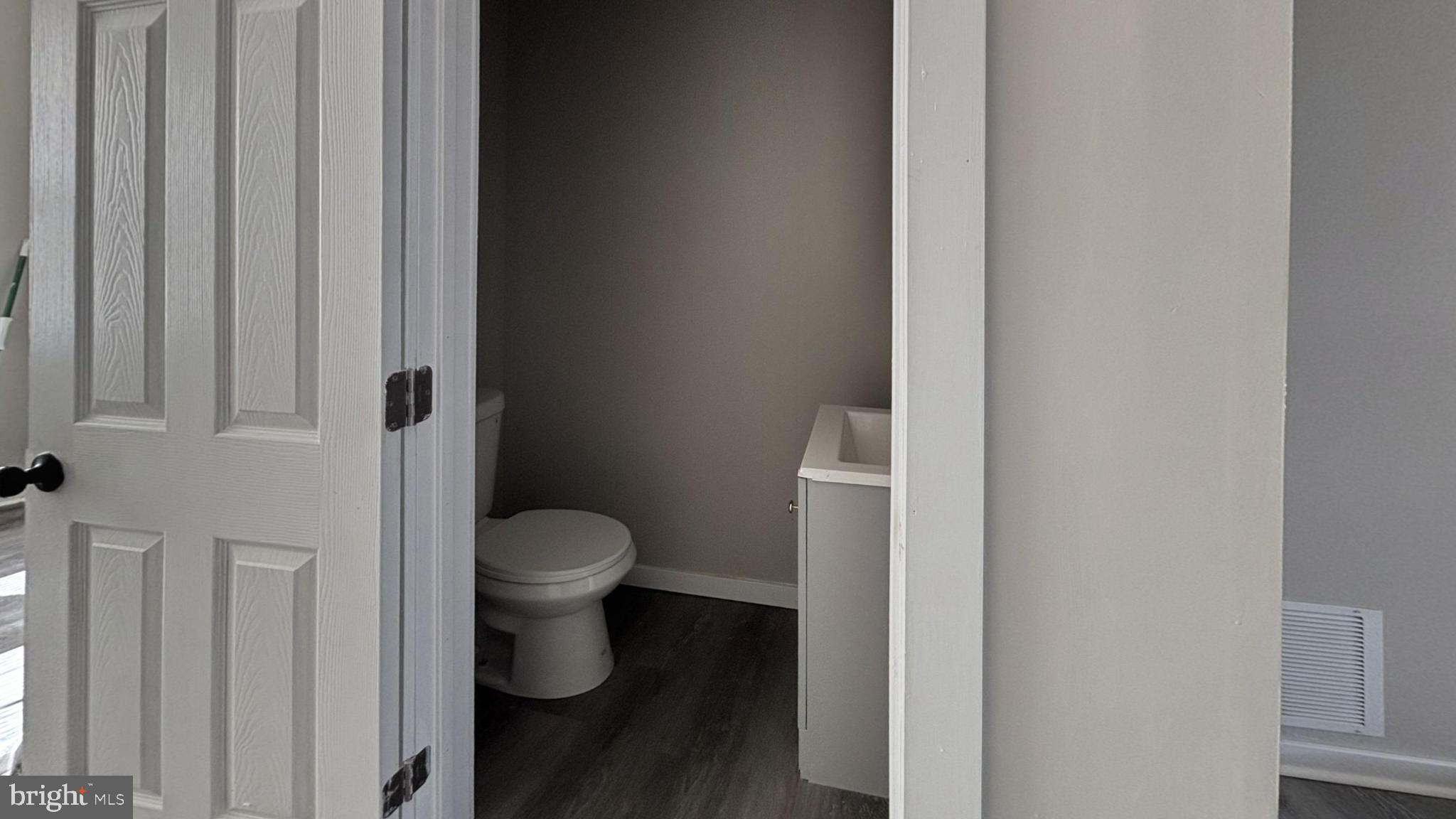 2644 South Felton Street Philadelphia, PA 19142 - Photo 9 of 9 a white toilet sitting next to a shower