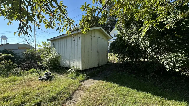 a backyard of a house with lots of green space