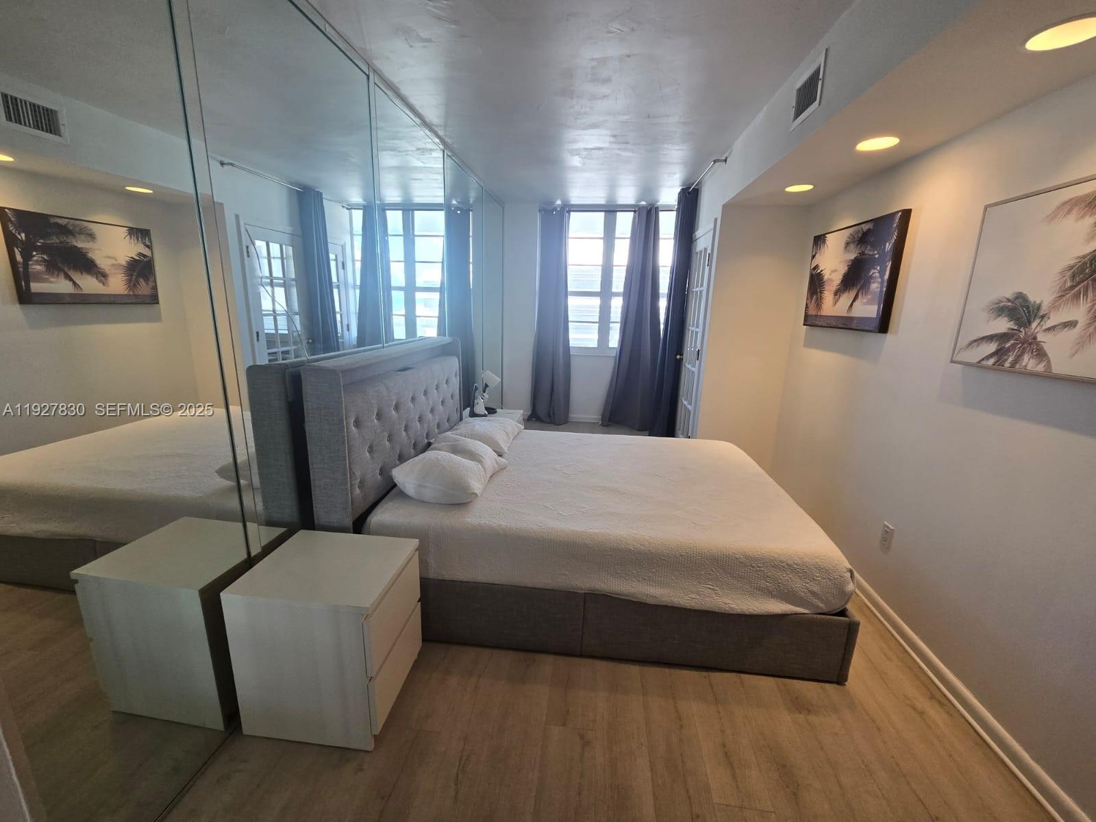 100 Lincoln Road, Unit 1227 Miami Beach, FL 33139 - Photo 6 of 11 a bedroom with bed and window
