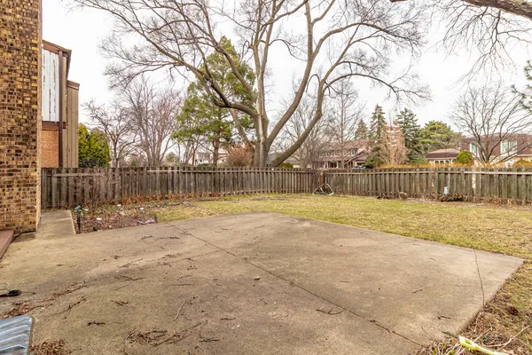 a house that has a tree in front of it
