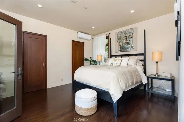 a bathroom with a granite countertop sink a toilet a mirror and shower