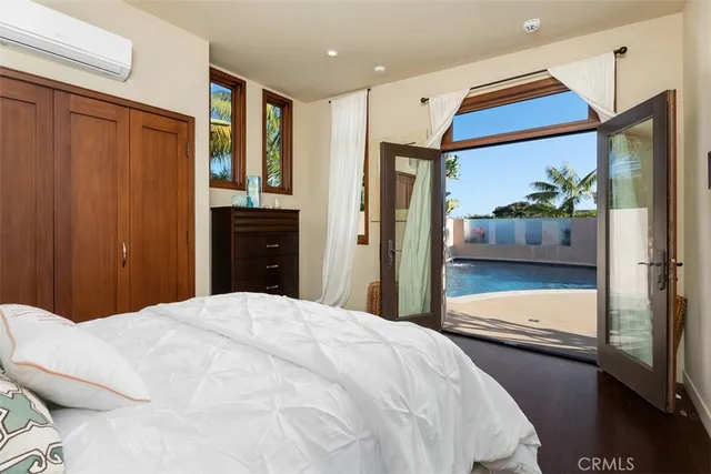 a view of a workspace with furniture and a flat screen tv