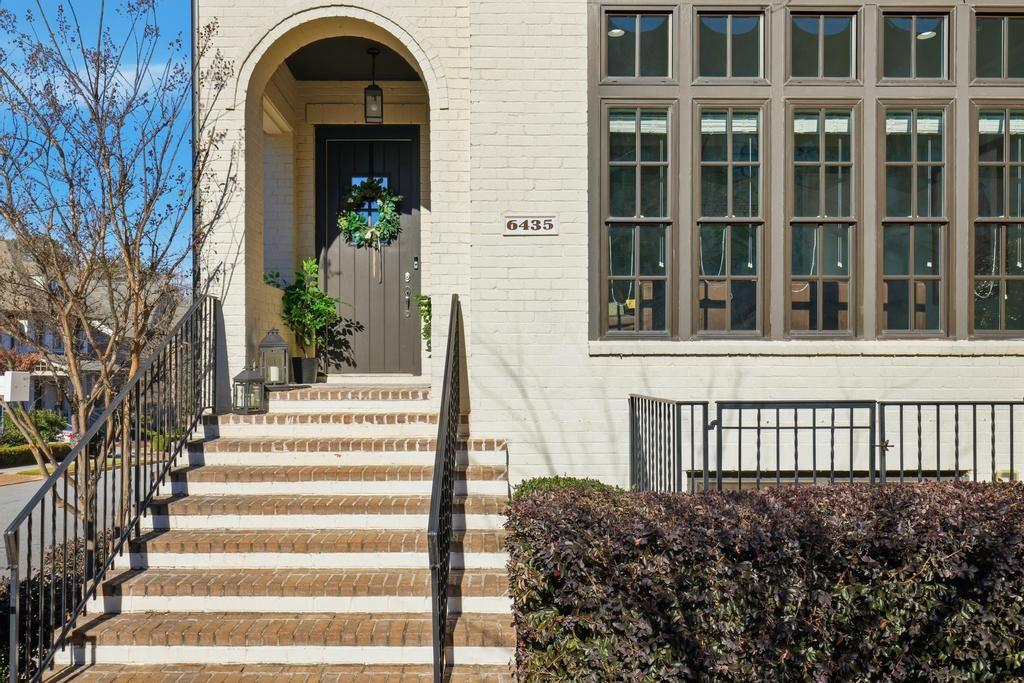 6435 Lucent Lane Atlanta, GA 30328 - Photo 1 of 1 a view of a brick house with large windows