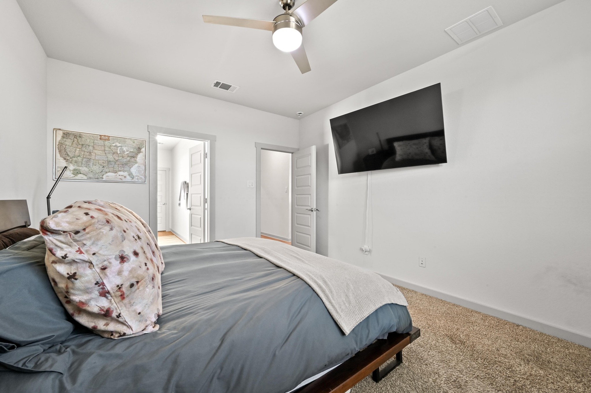 522 Wilshire Road San Marcos, TX 78666 - Photo 11 of 22 a bedroom with a bed and a flat screen tv