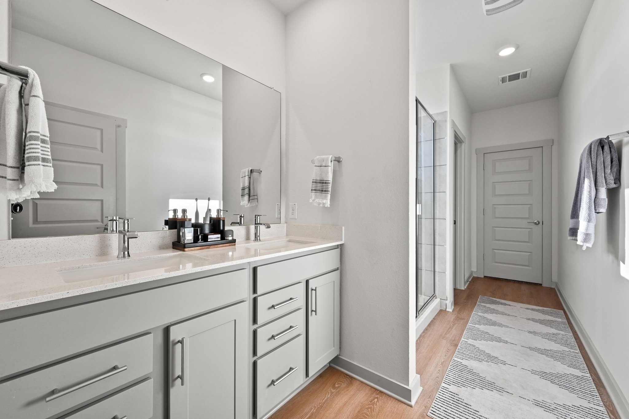 522 Wilshire Road San Marcos, TX 78666 - Photo 12 of 22 a en suite bathroom with a sink double vanity and mirror