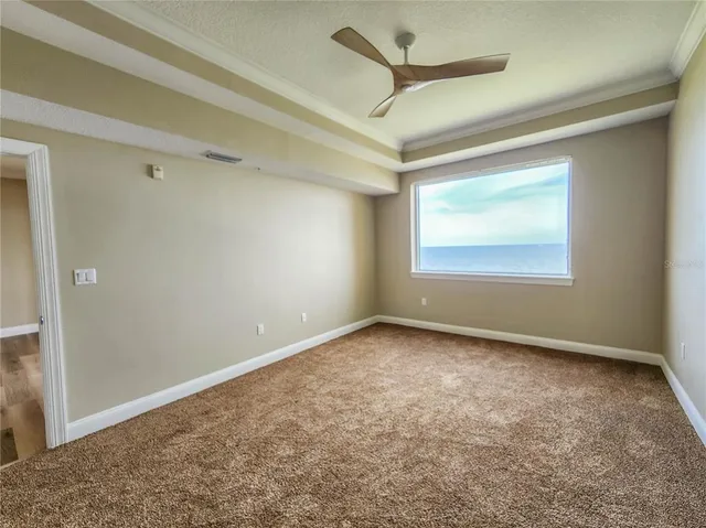 an empty room with a empty space and windows