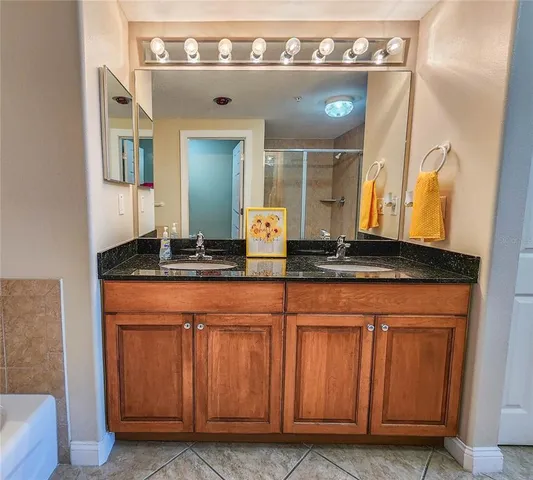 a bathroom with a sink and a mirror