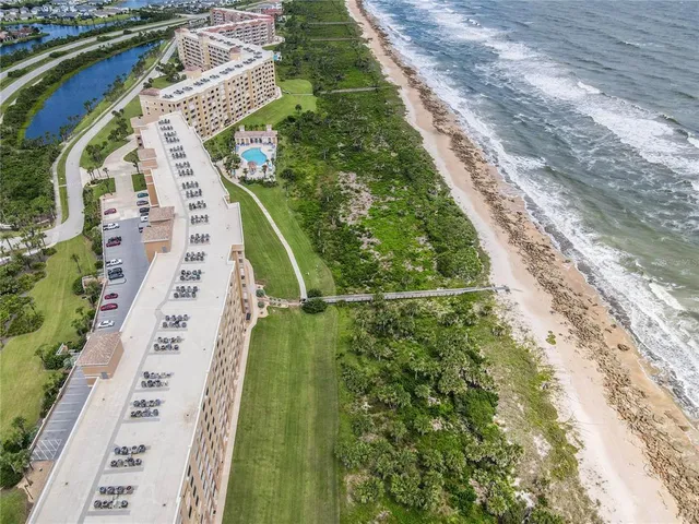 a view of outdoor space with a lake view and tall buildings