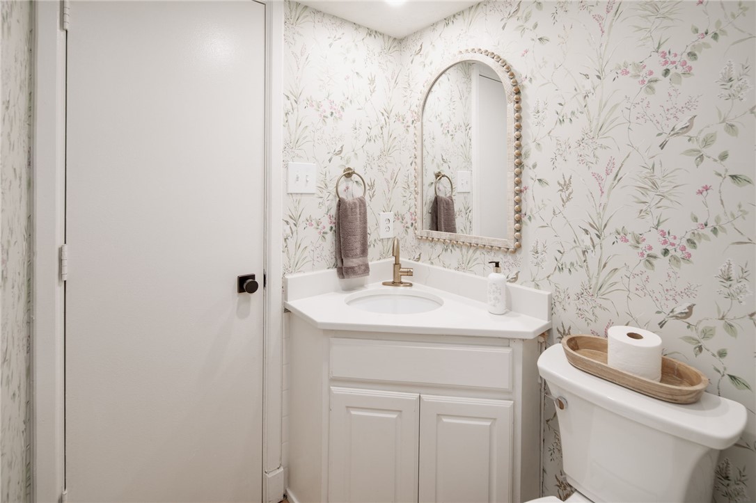 1015 East 24th Street Bryan, TX 77803 - Photo 21 of 43 a bathroom with a sink and a toilet