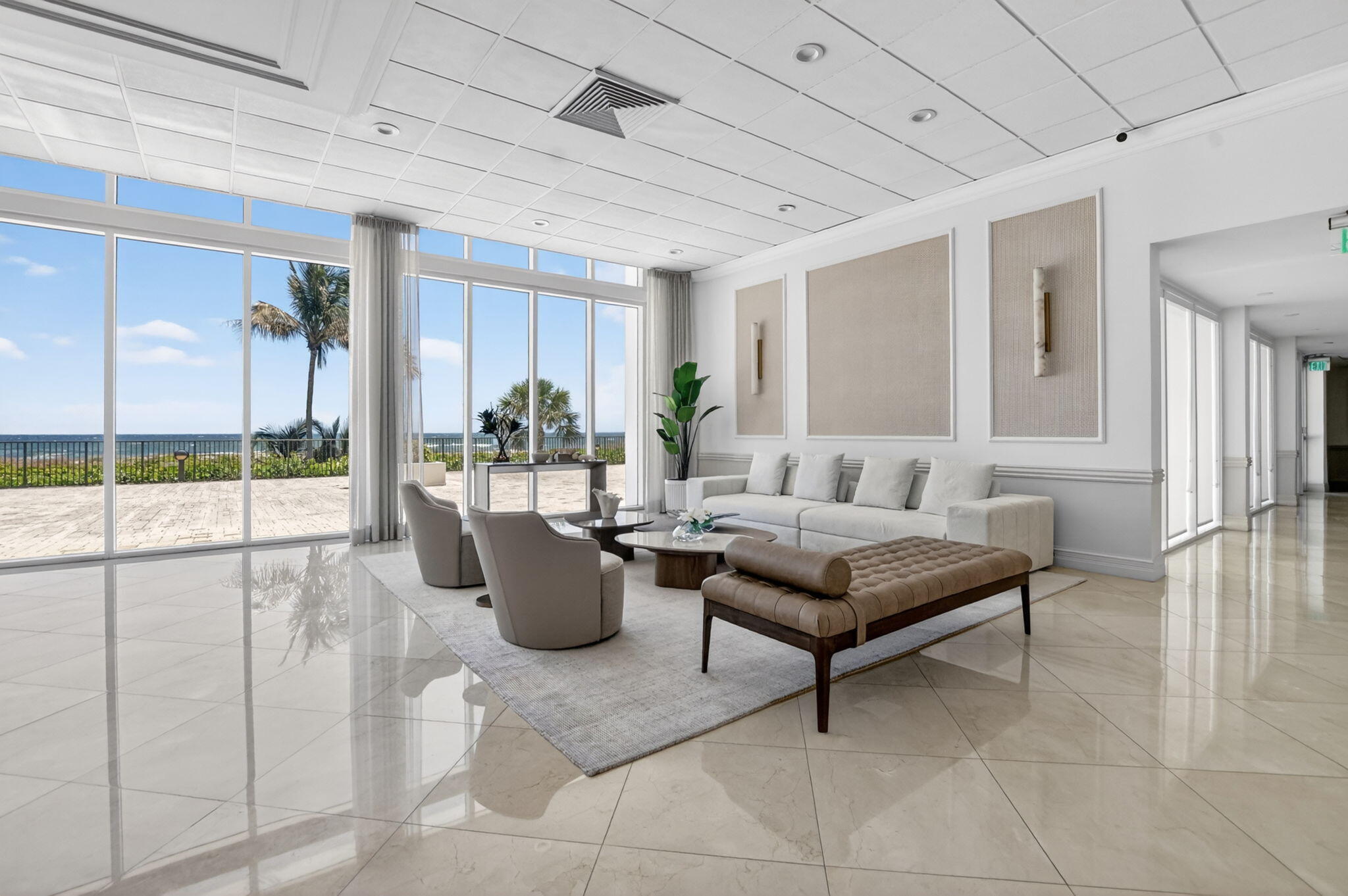 2800 South Ocean Boulevard, Unit 23C Boca Raton, FL 33432 - Photo 48 of 50 a living room with furniture and a potted plant