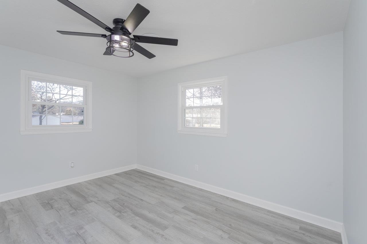12 Essex Road Grottoes, VA 24441 - Photo 32 of 65 wooden floor in an empty room with a window