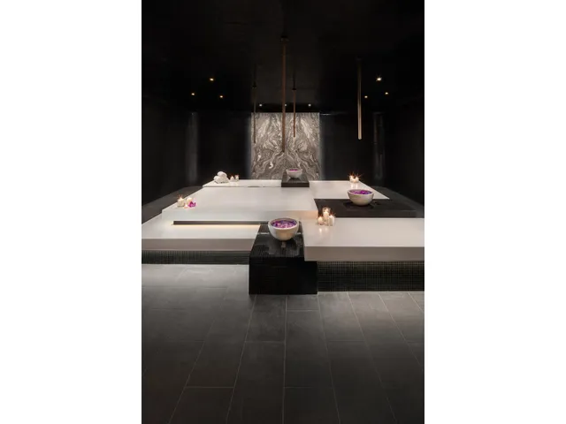 a en suite bathroom with a sink and a mirror