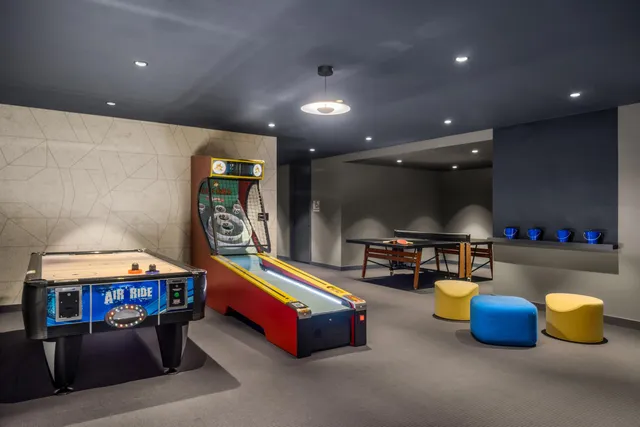 a room with furniture and pool table