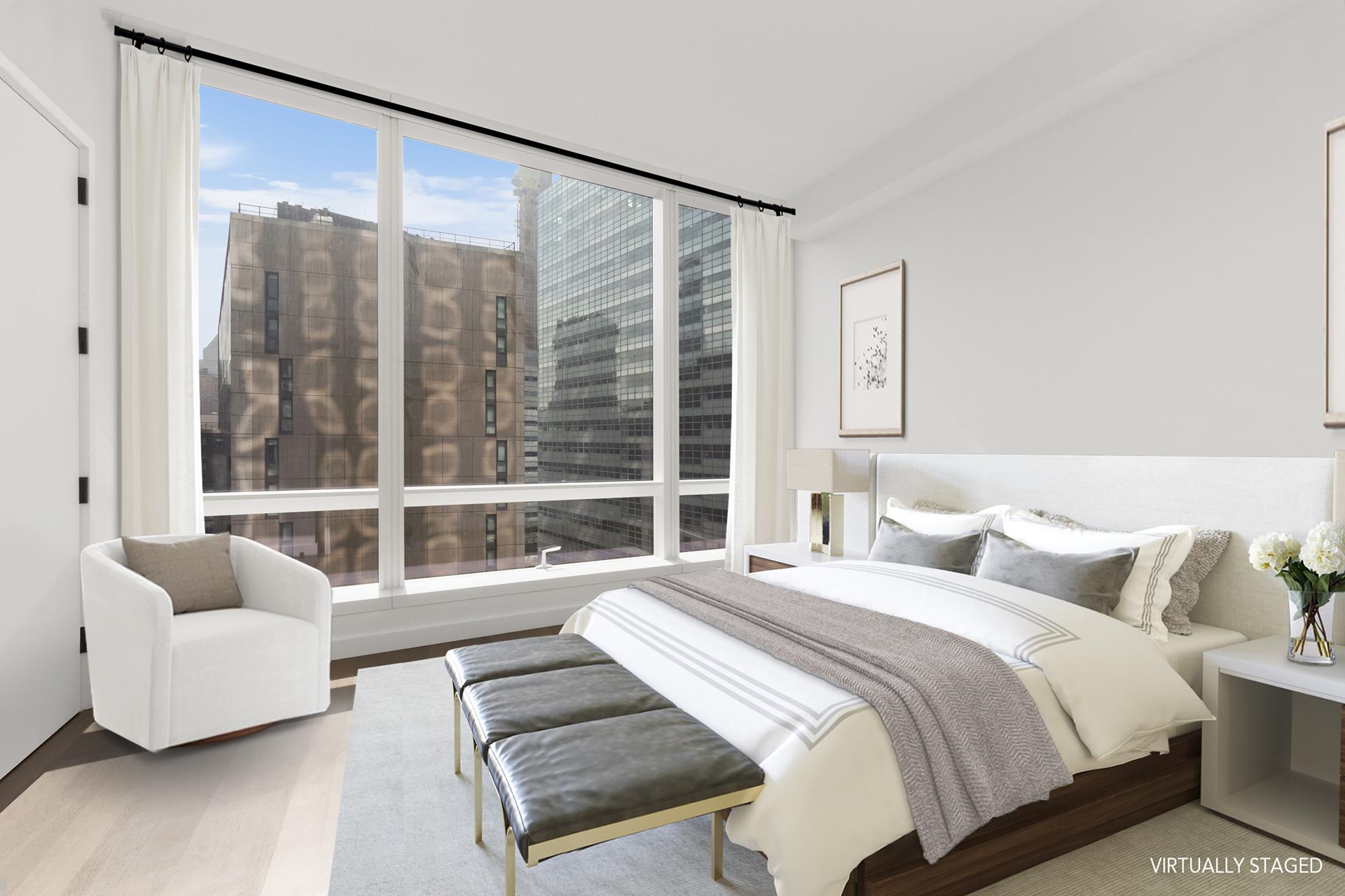 111 Murray Street, Unit 11B Manhattan, NY 10007 - Photo 4 of 25 a spacious bedroom with a bed and glass window