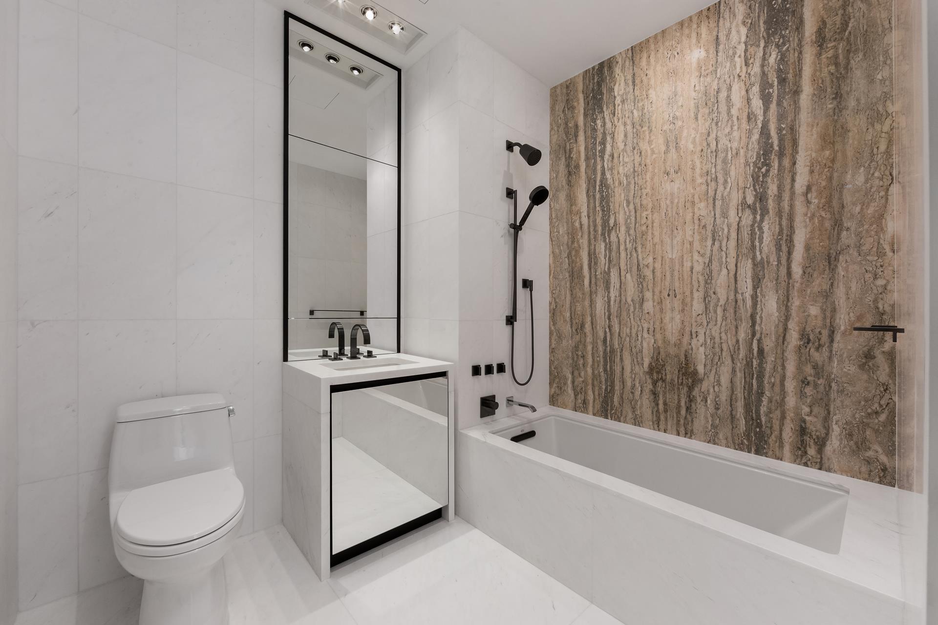 111 Murray Street, Unit 11B Manhattan, NY 10007 - Photo 5 of 25 a bathroom with a toilet a sink and bathtub