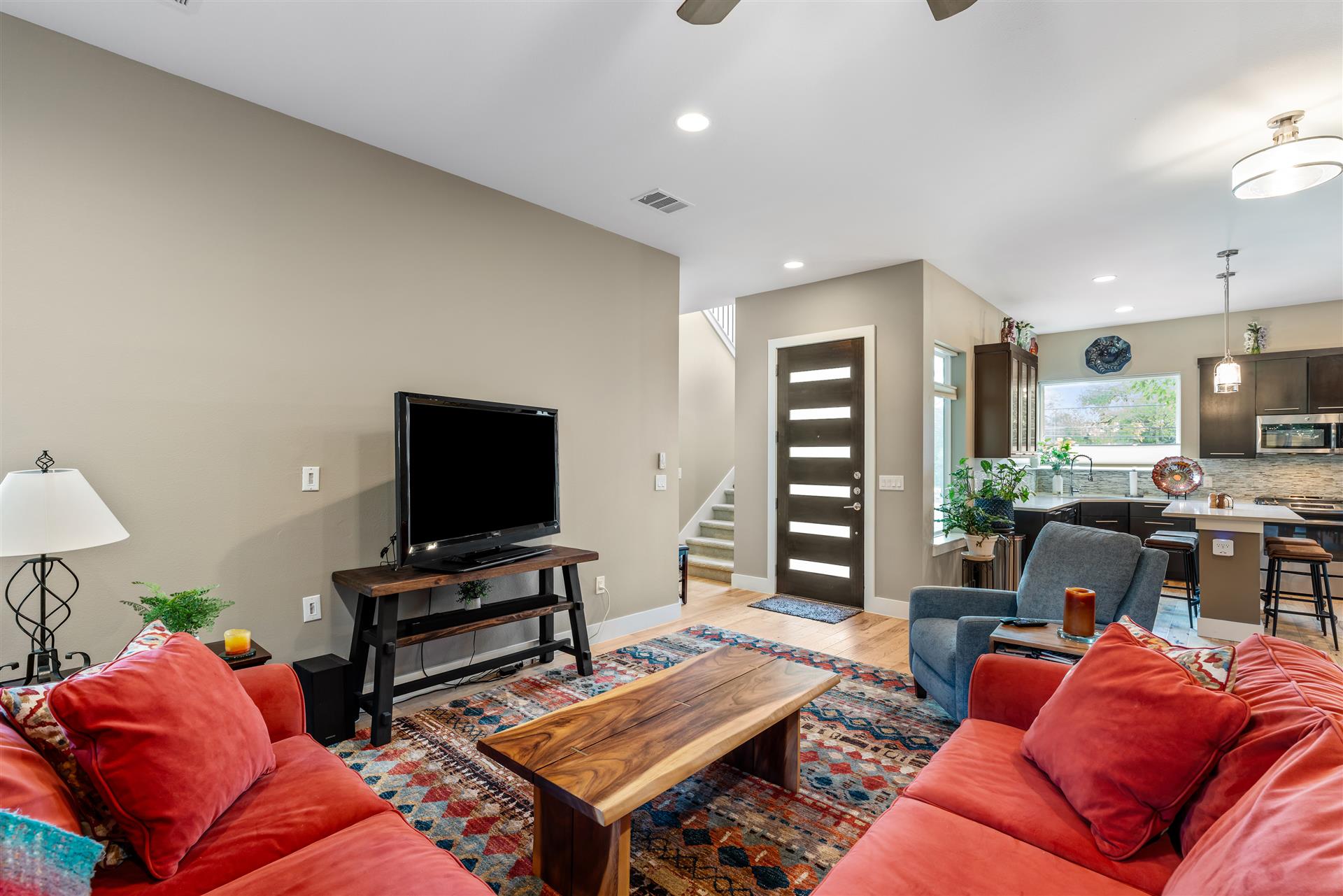 3806 Bull Creek Road, Unit B Austin, TX 78731 - Photo 12 of 37 A hallway to the left of the front door leads to a full bathroom, a secondary bedroom or office, and a side door providing convenient access to the carport.