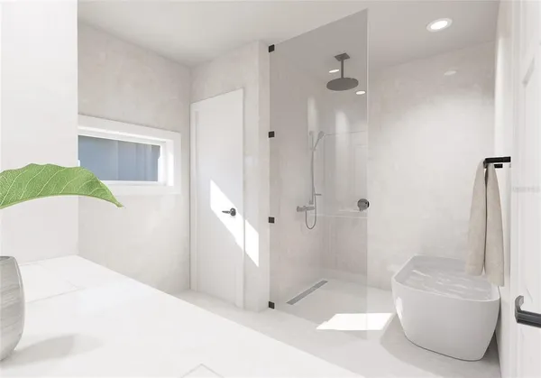 a bathroom with a tub and shower