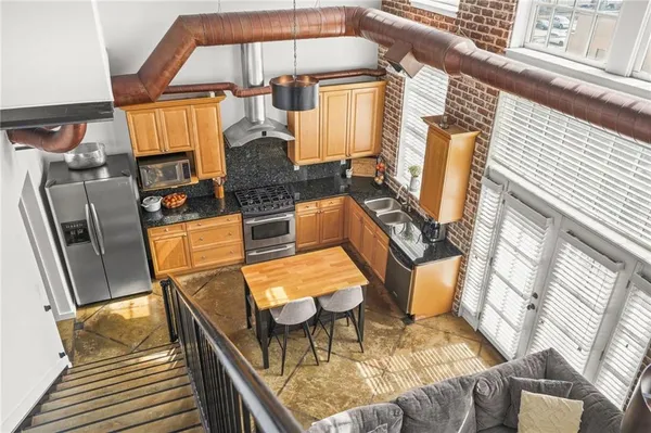 a view of balcony with furniture