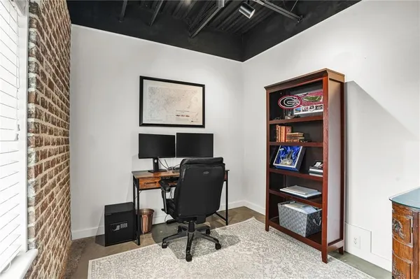 a view of a workspace with furniture