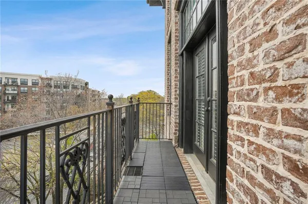 a view of a balcony with city view
